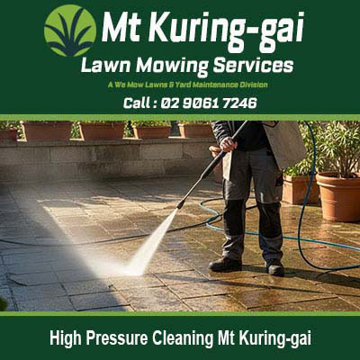 Worker pressure washing patio surface in Mt Kuring-gai